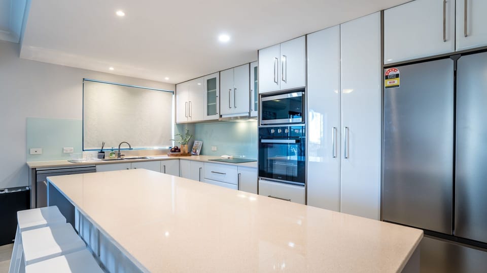 Large stone benchtop with plenty of space for meal preparation.
