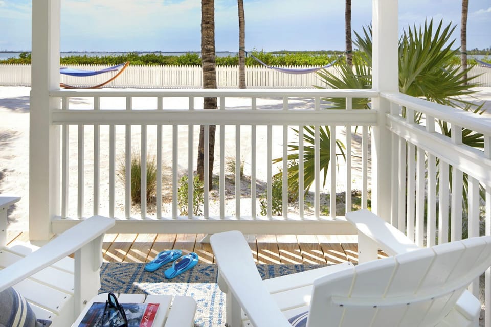 Sip morning coffee on the balcony with tropical views.