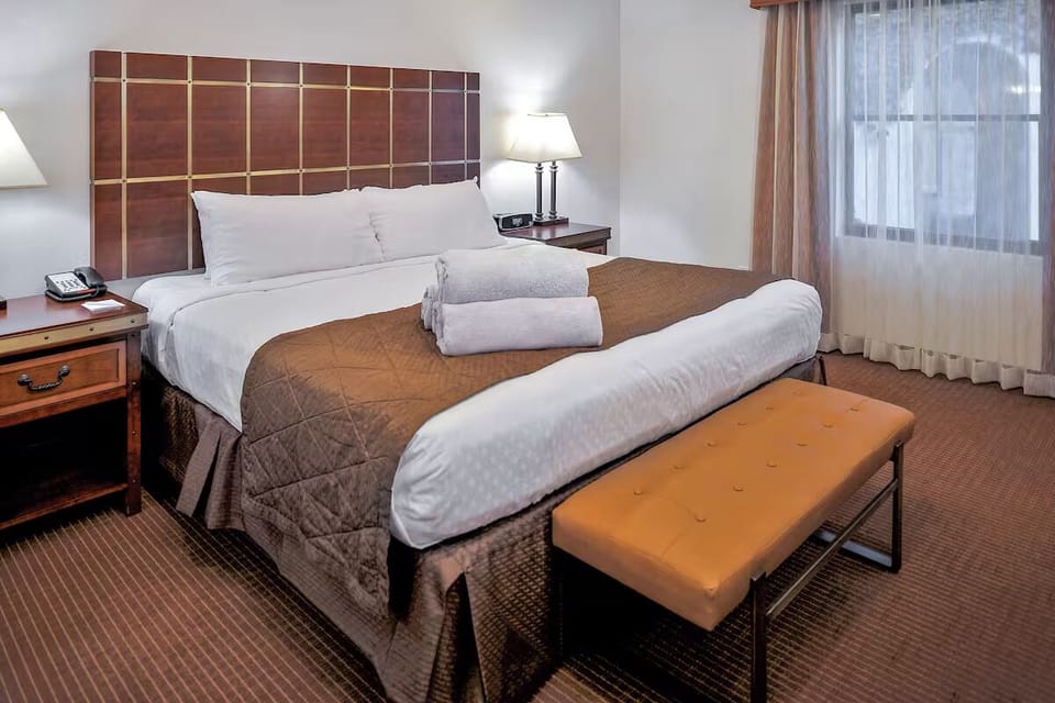Unwind into crisp linens and enjoy a peaceful night’s sleep