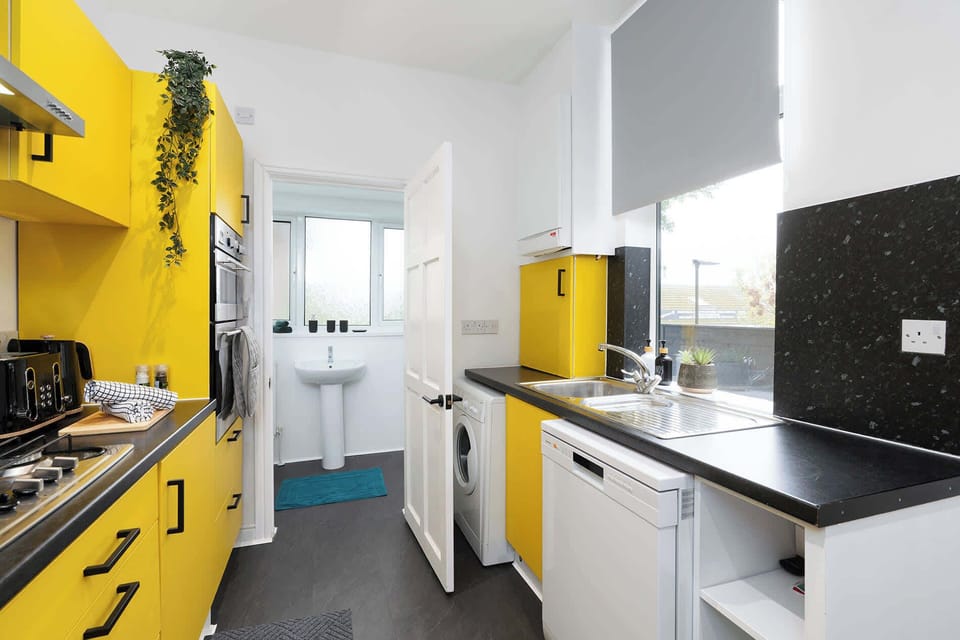 Stylish kitchen with modern appliances and all the essentials – perfect for preparing home-cooked meals during long projects.
