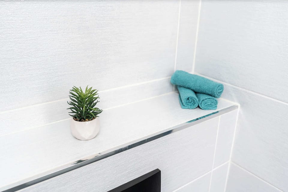 Stylish bathroom with fluffy towels provided