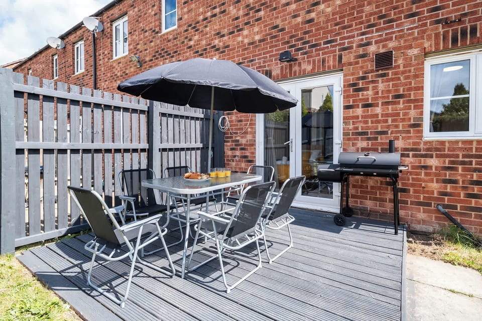 An inviting outdoor seating area, perfect for relaxing and enjoying a barbecue