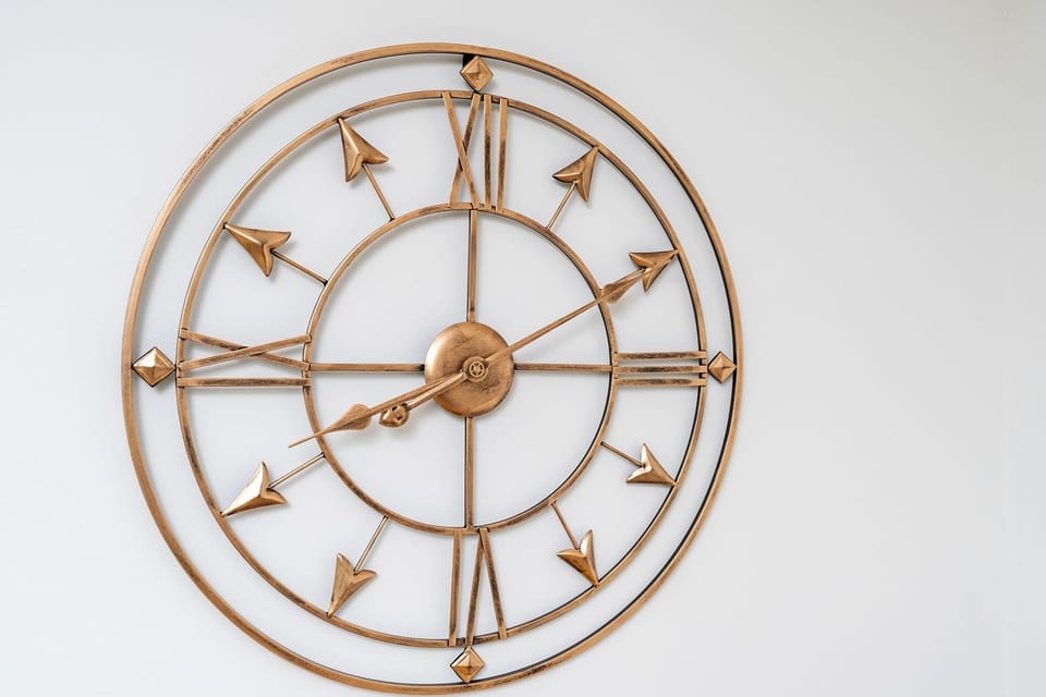 Elegant wall clock adding a warm, stylish touch to the interior.