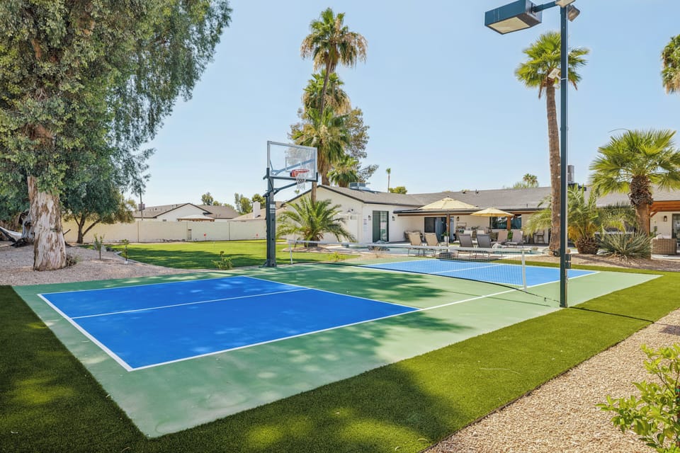 Private backyard sport court, poolside lounging, and sunny resort vibes