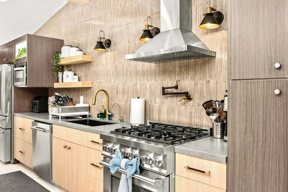 Kitchen is fully equipped with professional-grade stainless steel appliances, a high-end gas range, and cooking utensils for all your culinary needs.
