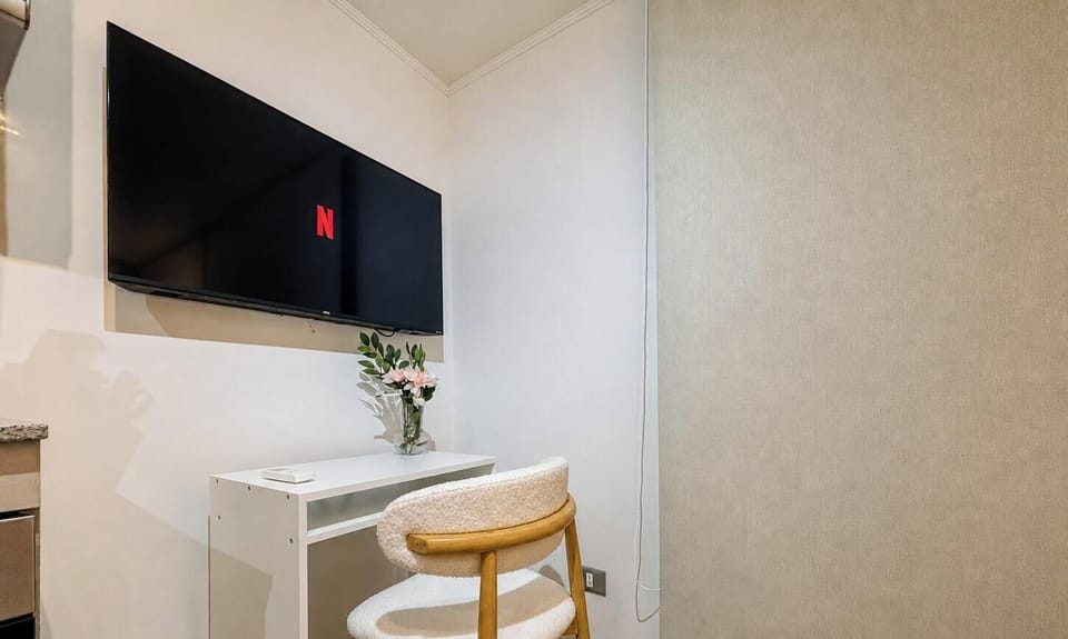 Cozy TV nook with desk seating for streaming or remote work