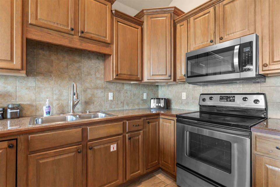 The open kitchen offers ample space & all the comforts of home​