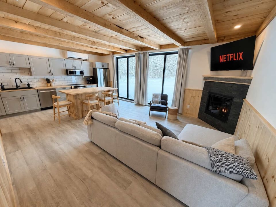 Living Room: Relax in a bright and inviting living room with comfortable seating, tasteful décor, and plenty of space to unwind after a full day of exploring the area.