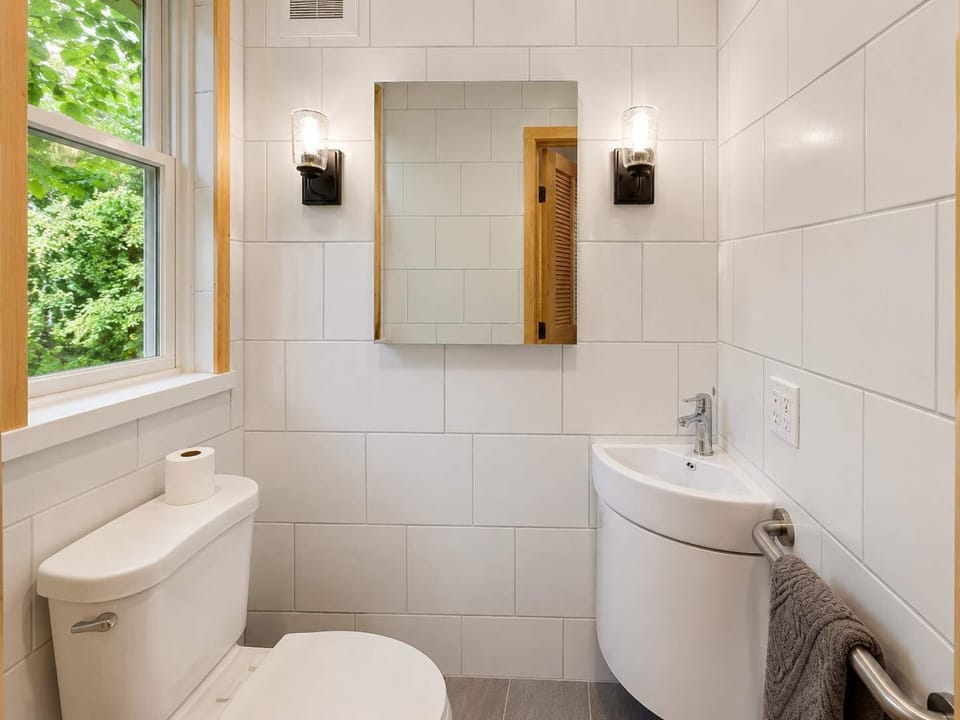 Full Bathroom: Freshen up in this clean full bathroom featuring a convenient walk-in shower, functional vanity, and everything needed for a comfortable daily routine.