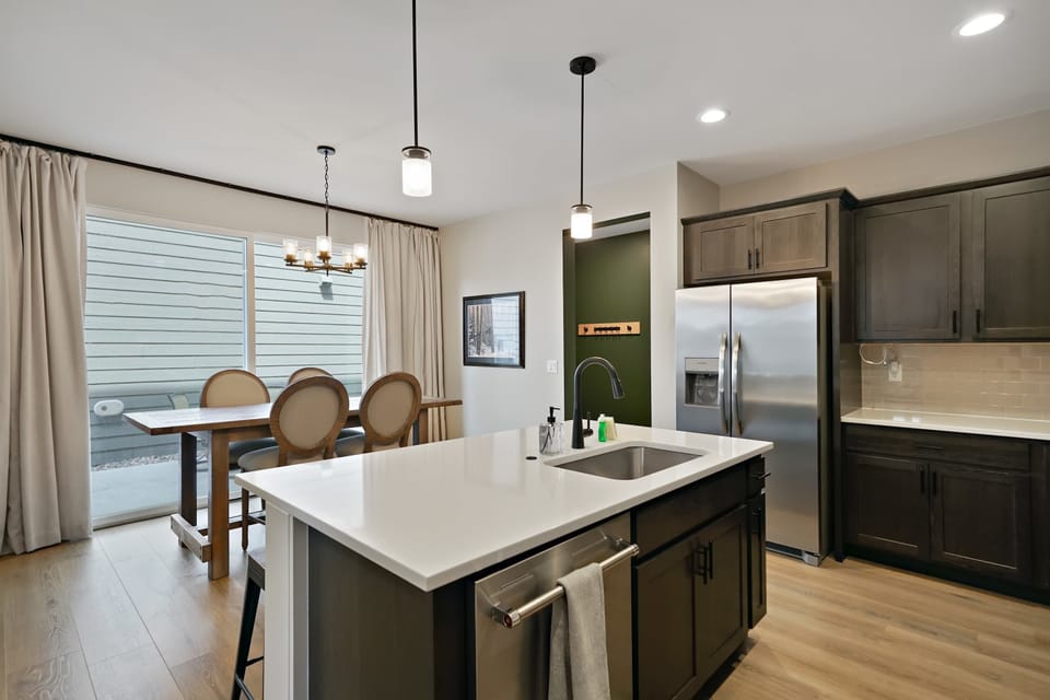 Kitchen: Prepare meals with ease in this well-equipped kitchen, featuring ample counter space and everything needed for morning coffee, quick snacks, or home-cooked dinners.