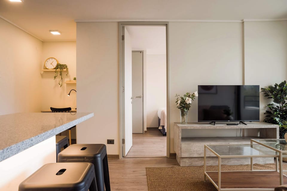 Cozy living area with modern decor and a spacious layout, perfect for relaxation and entertainment.