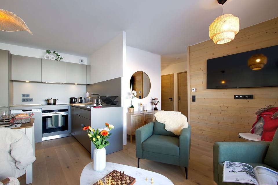 Warm wood tones run through this bright corner, just off the open living area.