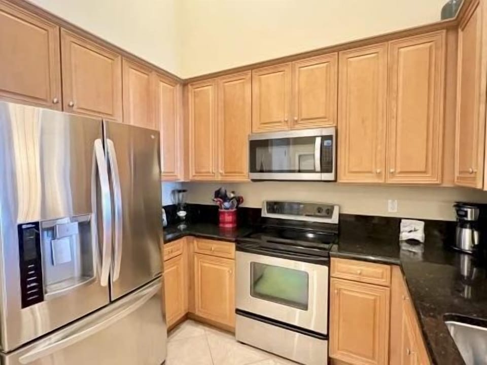 Fully equipped kitchen with full-size appliances, dishwasher, cookware, and everything for a home-cooked meal