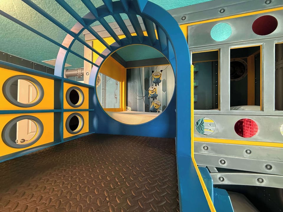 The Banana Minions Room (Sleeps 4).  A bright and playful Minions-inspired world featuring: 🛏️ 2 custom bunk beds. This room feels like stepping directly into the Minions universe.