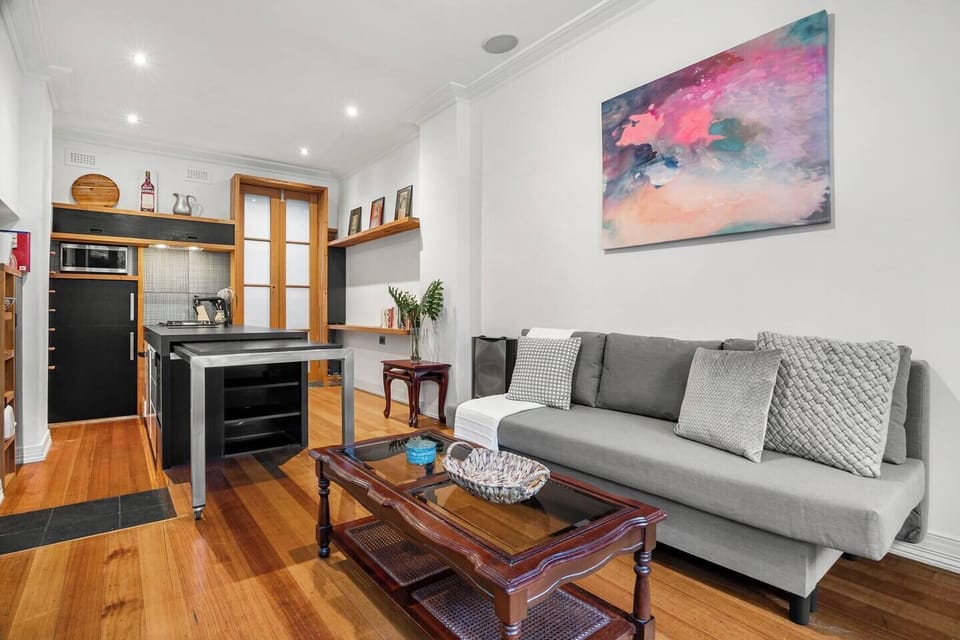This single-level apartment flows effortlessly, combining comfort, creativity, and thoughtful design for a seamless experience.