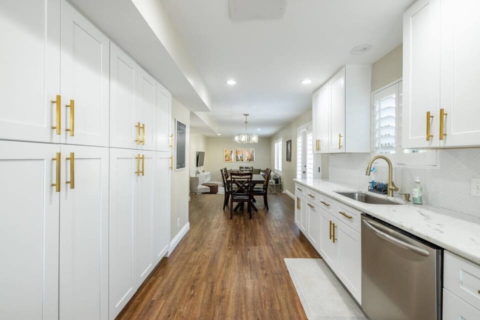Bright open kitchen with modern finishes and easy access to the dining area