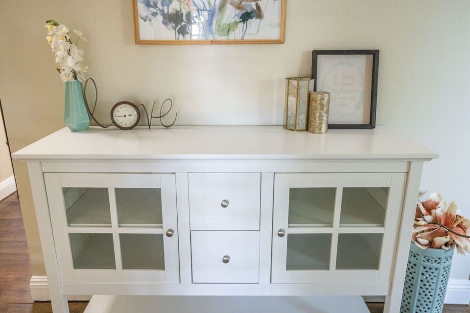 Elegant storage cabinet offering serving space and charming home decor