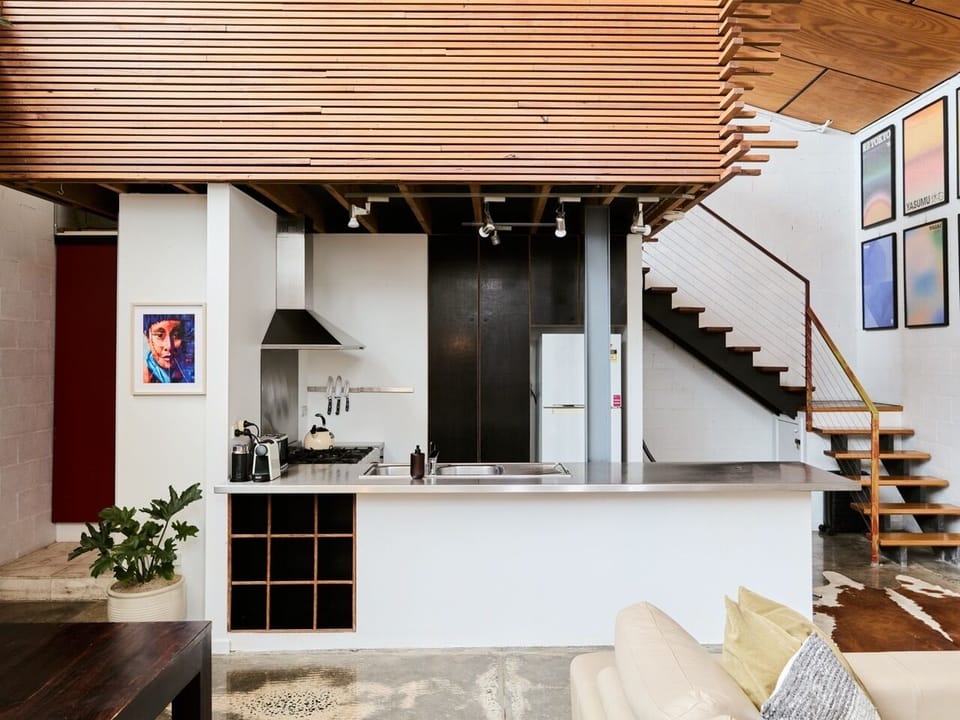 Prepare meals in the kitchen, where generous bench space, a gas cooktop, oven and open connection to the dining and living areas make cooking part of the experience.