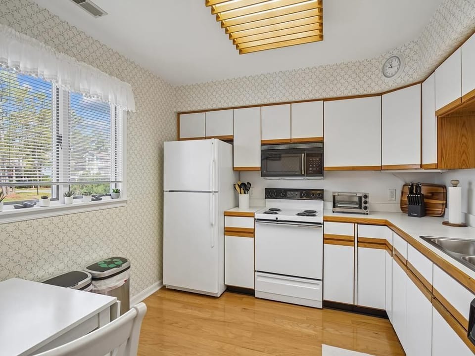 Enjoy a fully stocked kitchen with natural light and seating for meals together
