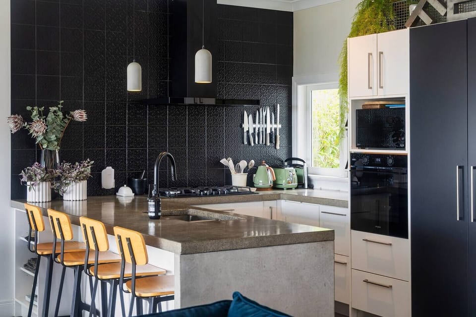 Fully equipped kitchen complete with bar seating