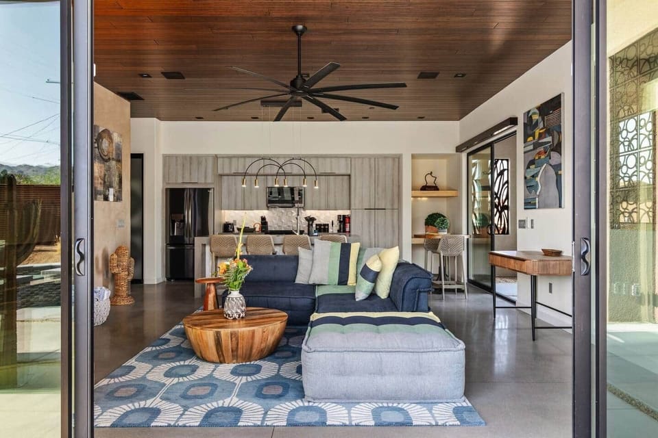 Large sliders open from the back patio to the open floorplan living space
