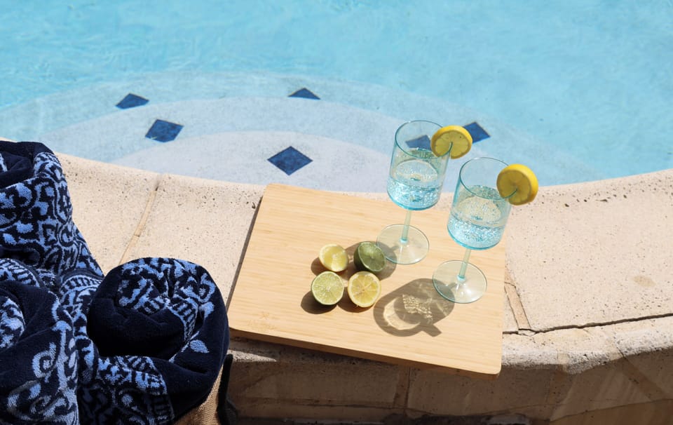 Refreshing poolside setup with citrus drinks and a resort-style vibe