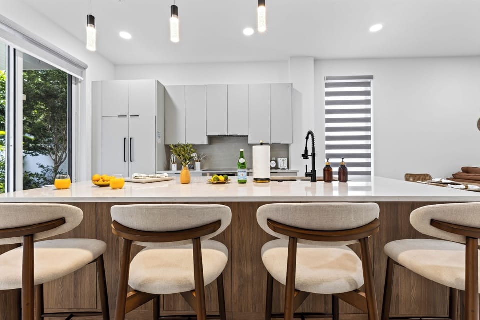 Pull up a seat at the generous kitchen island for coffee, cocktails, or casual bites.