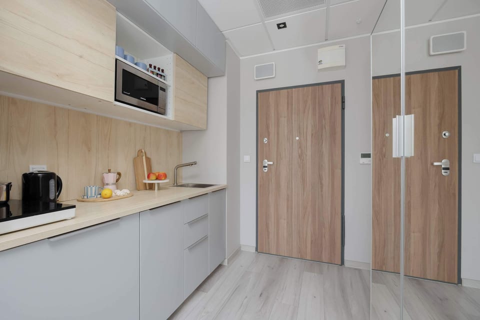 Comfortable bedroom area with a double bed and spacious built-in wardrobe.