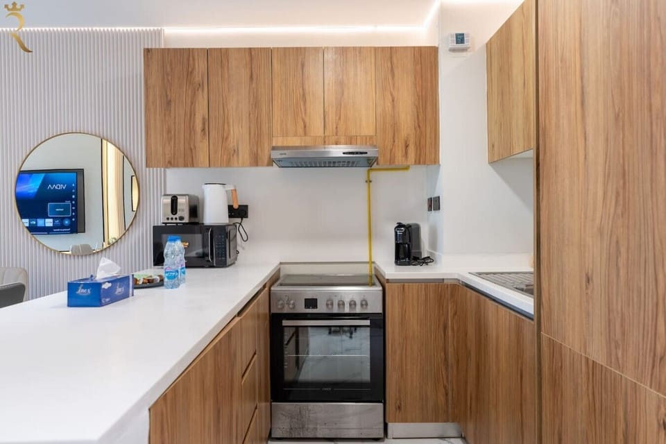 Fully equipped kitchen with a full-size oven and stove, microwave, kettle, and coffee maker — everything needed to cook like home.