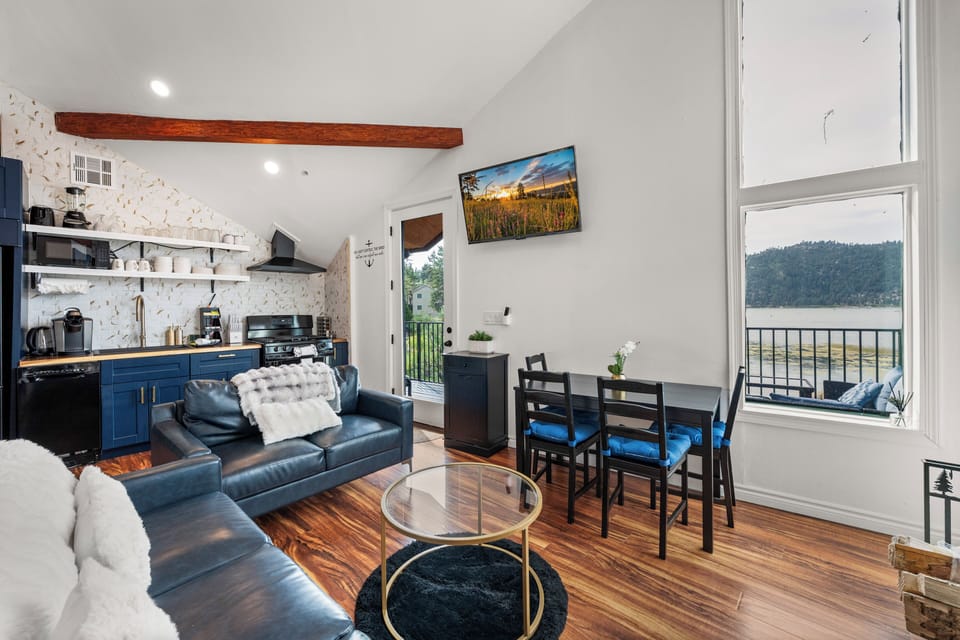 Living Room - Living Room with lake views, comfy seating area, smart TV and vaulted ceilings.