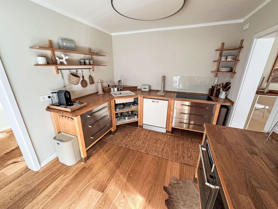 Flooring, Furniture, Wood, Cabinetry, Interior Design, Floor, Wood Flooring, Drawer, Countertop, Kitchen
