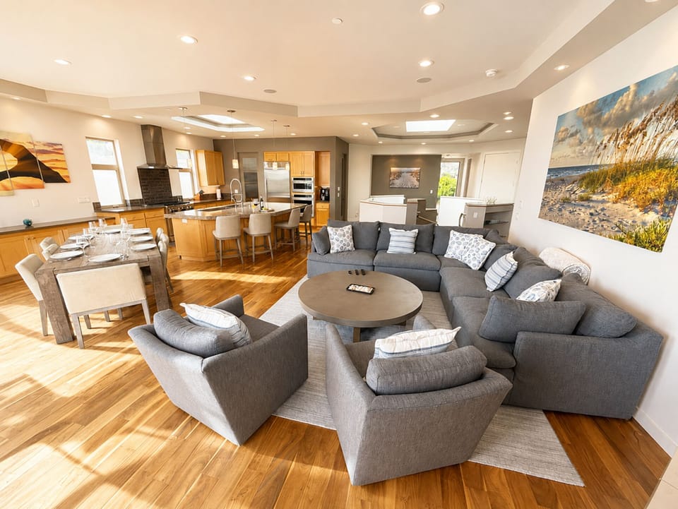 Open living space easily connects the - living room, dining area, and kitchen.