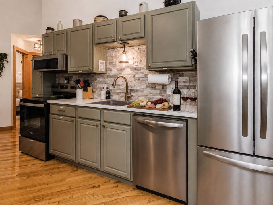 The updated kitchen offers modern appliances and everything needed for meals at home.