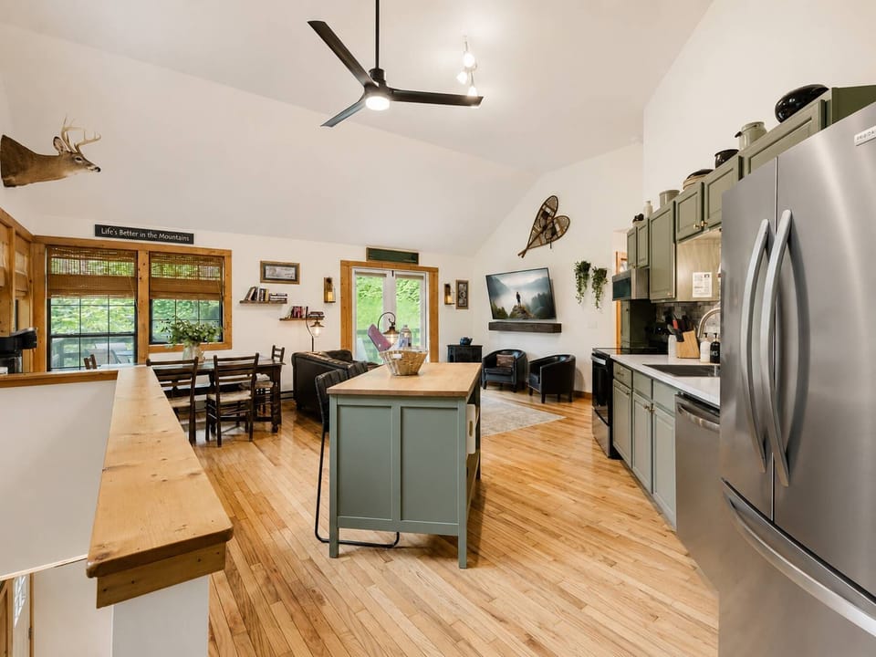The open layout keeps everyone connected from the kitchen to the living room.