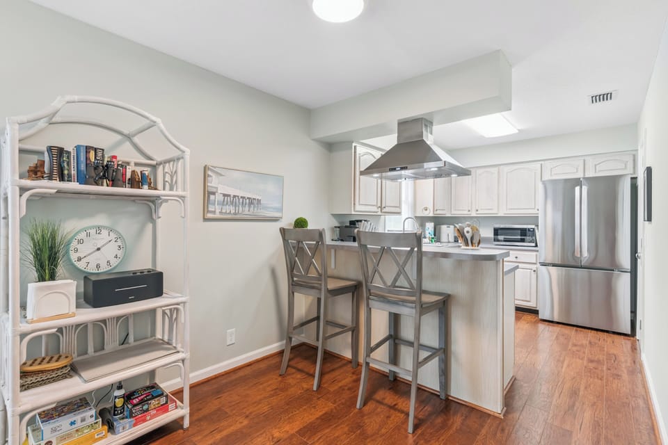 Your fully equipped kitchen features stainless steel appliances, generous counter space, and a breakfast bar where you can enjoy your morning coffee while planning the day's adventures.