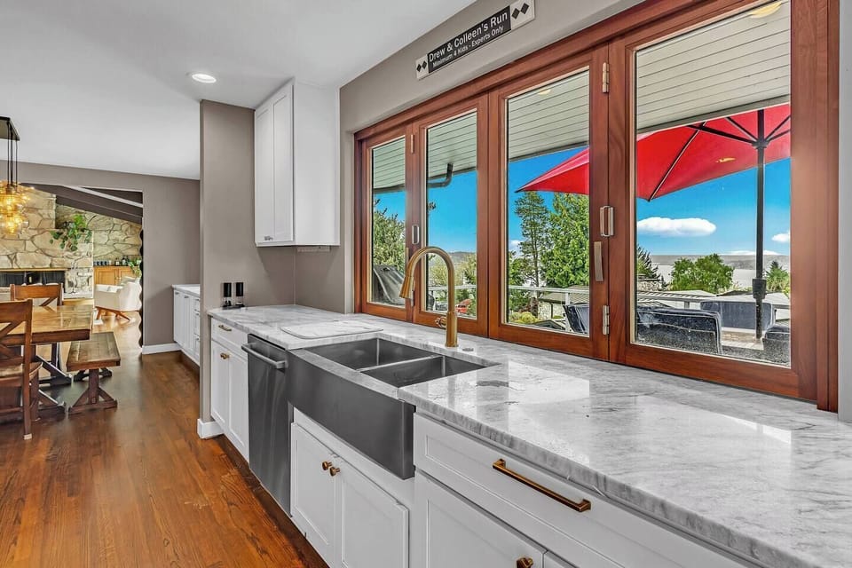Enjoy beautiful, sunny views of the backyard and patio while prepping snacks or washing up. Perfectly connects the indoor dining room to the outdoor entertaining spaces.