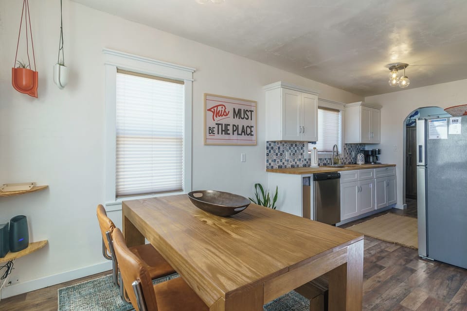 The open dining area flows directly into the kitchen, making shared meals simple and relaxed.