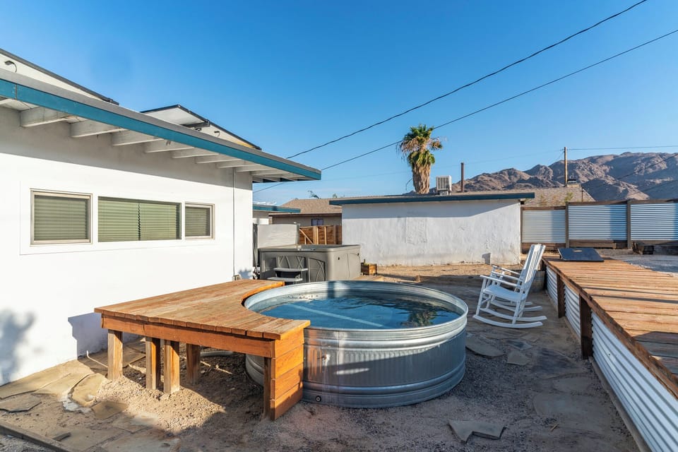 Cool off in the cowboy pool, then kick back in the nearby rocking chairs with views of the surrounding desert mountains.
