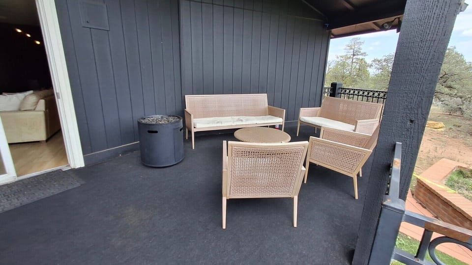 Deck with fire table for cool mountain evenings — s`mores strongly encouraged