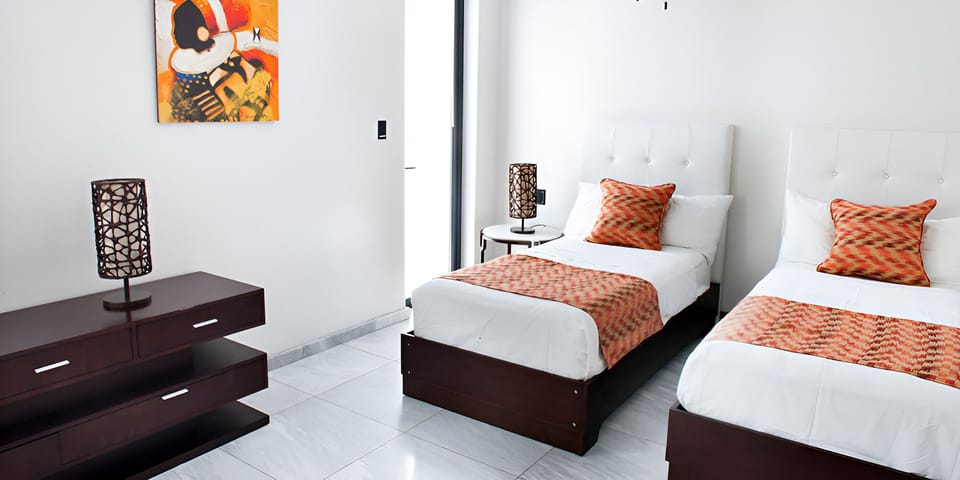 Settle in comfortably with twin beds and crisp, hotel linens.