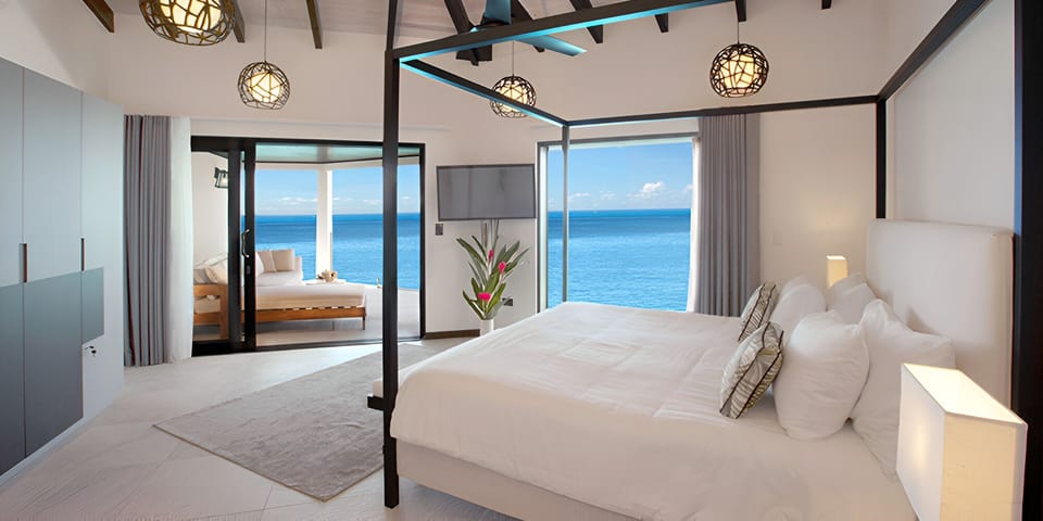 Wake up to sweeping sea views from plush linens.