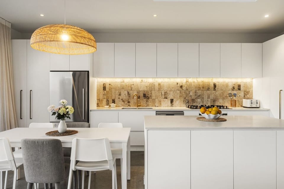 Sleek designer kitchen with generous bench space for cooking and entertaining