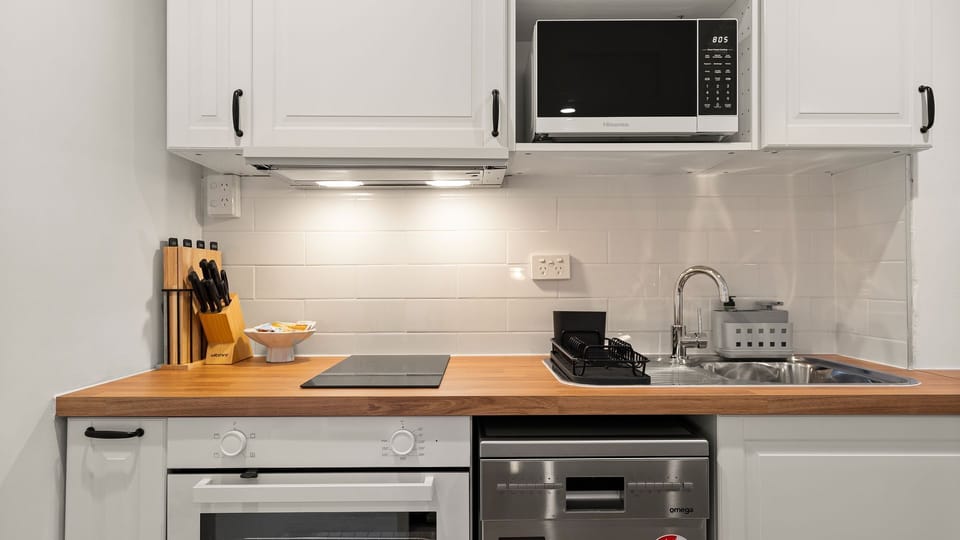 Compact kitchenette with everything needed for your stay.