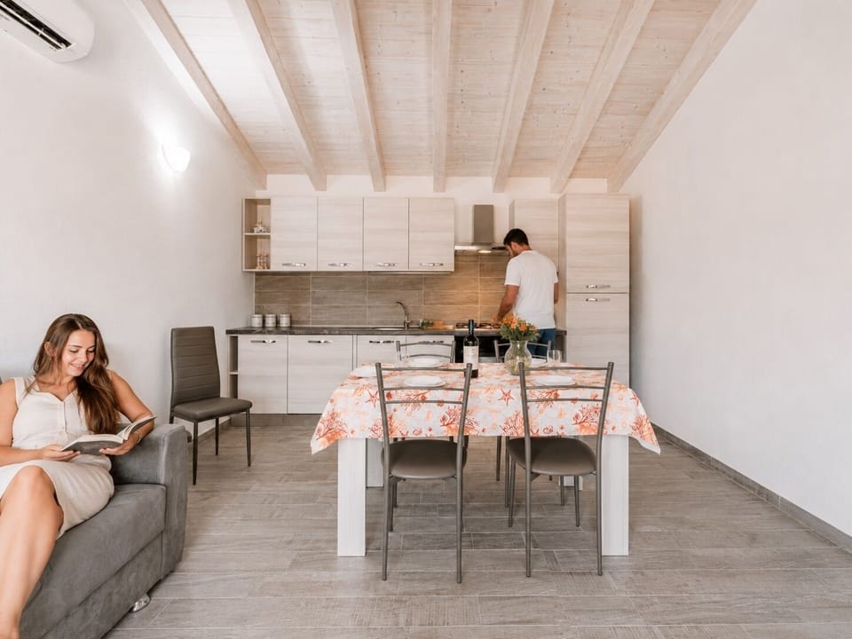 Bright open-plan kitchen and dining area with airy modern style