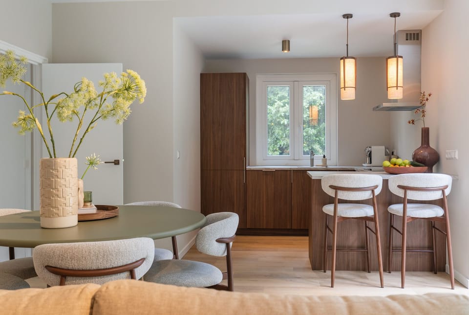 Bright modern kitchen and dining area with breakfast bar and natural light