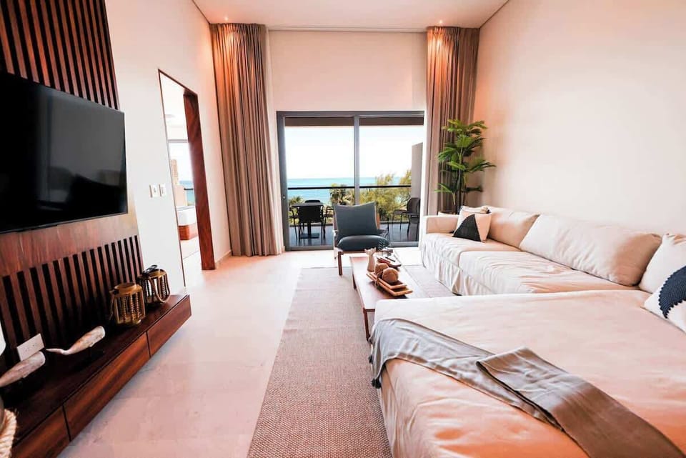 Living room with balcony access and sofa bed 