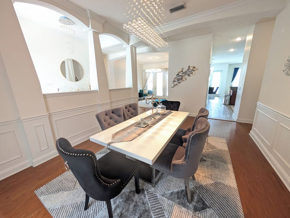 Enjoy meals together in the home's dedicated dining room, surrounded by bright and polished finishes.