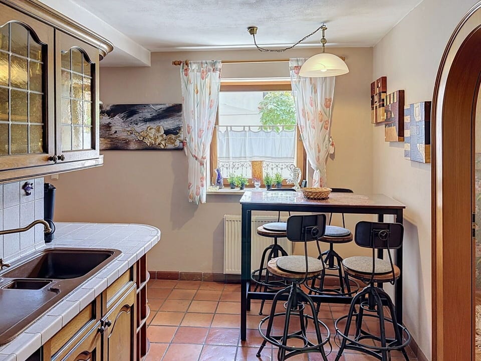 Furniture, Interior Design, Kitchen, Countertop, Wood, Cabinetry, Flooring, Lighting, Light Fixture, Room