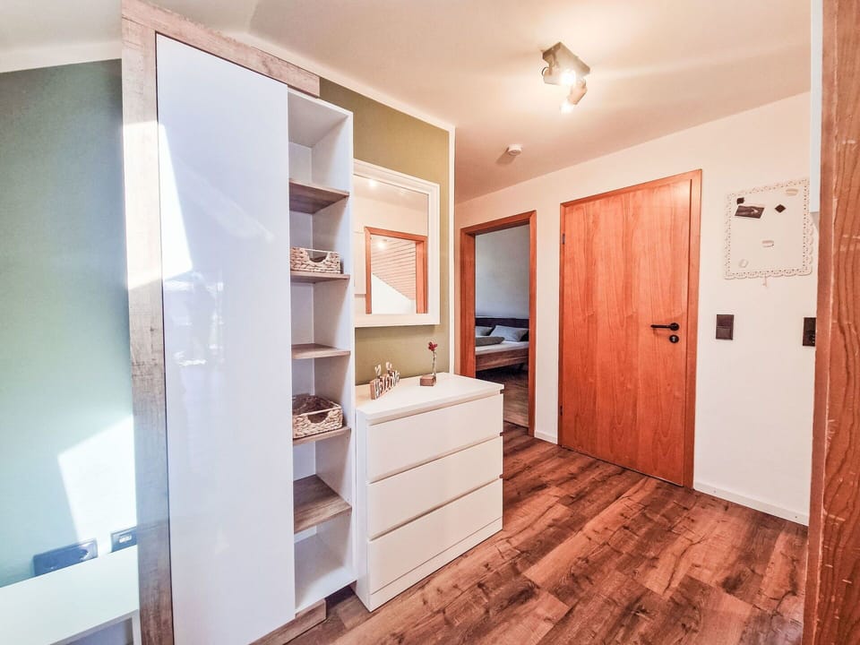 Flooring, Wood, Floor, Interior Design, Furniture, Wood Flooring, Room, Ceiling, Apartment, Cabinetry