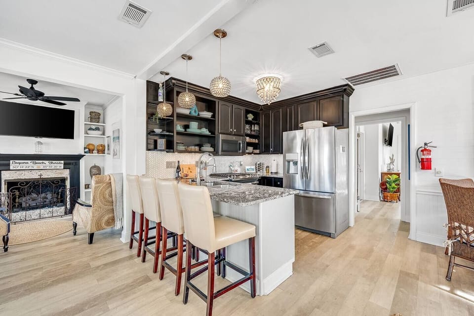 Open concept remodeled kitchen with full appliance package and  counter seating for 4